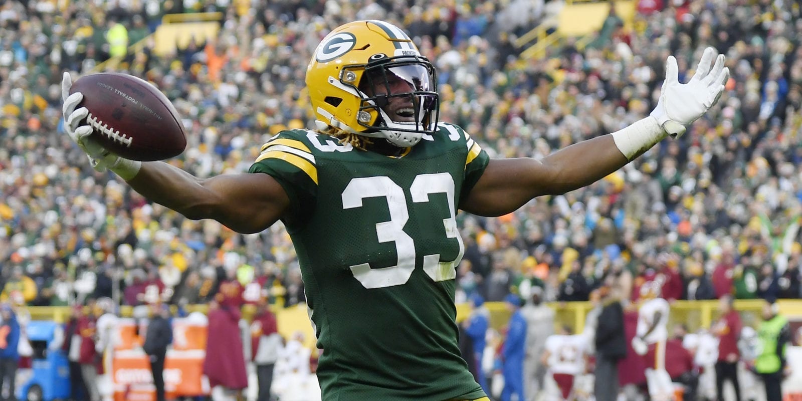 American football player Aaron Jones is celebrating a first down