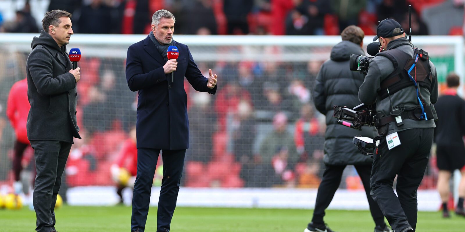 Garry Neville and Jamie Carragher presenting Sky Sports from the middle of a football pitch