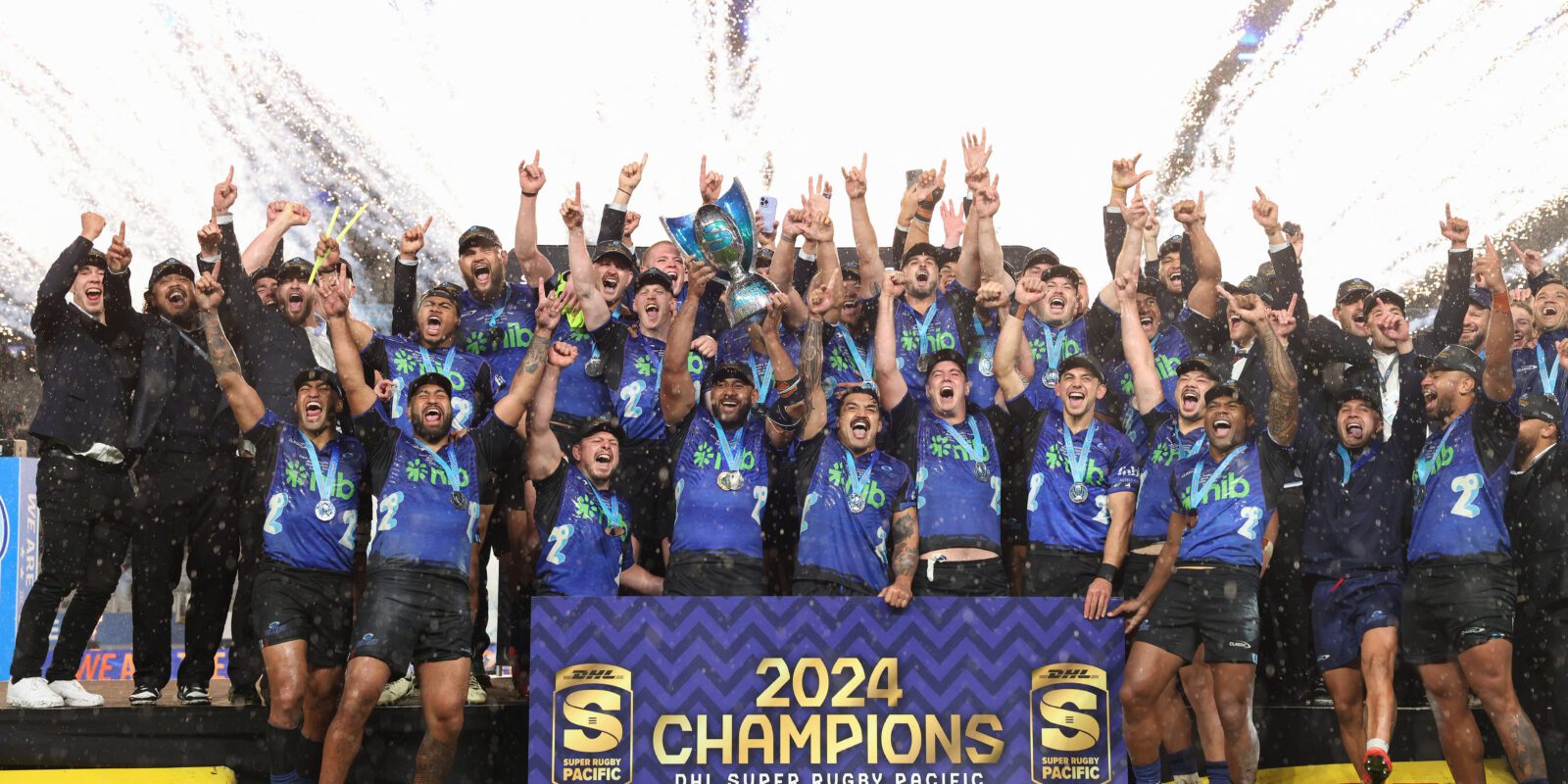 Auckland Blues lifting the 2024 Super Rugby Pacific Trophy.